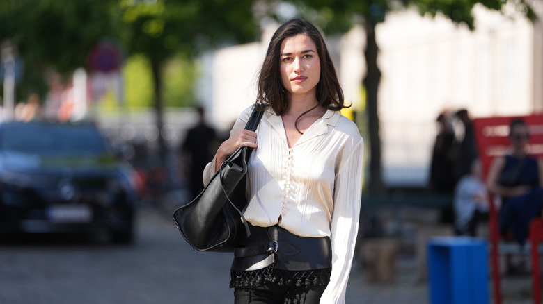 Woman wearing a cream blouse