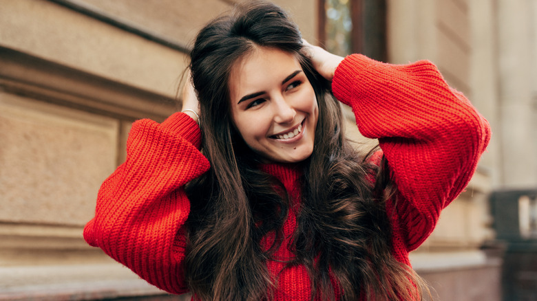 Woman wearing a red sweater
