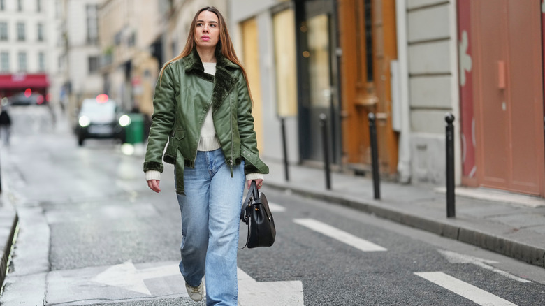 Woman wearing green jacket
