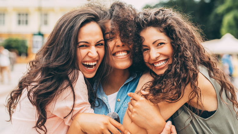 three women embracing