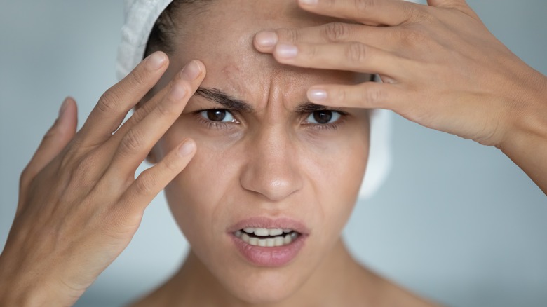 Woman touching face