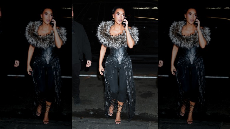 Kim Kardashian wearing black capri pants in 2025