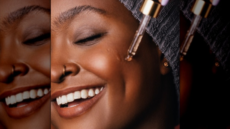 Woman applying serum 
