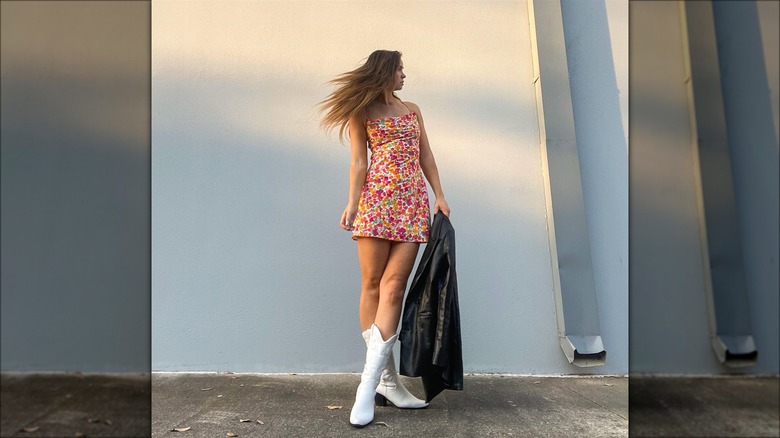 Woman in a dress and cowboy boots