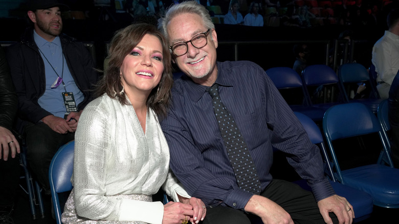 Martina McBride and John McBride smiling together in 2022