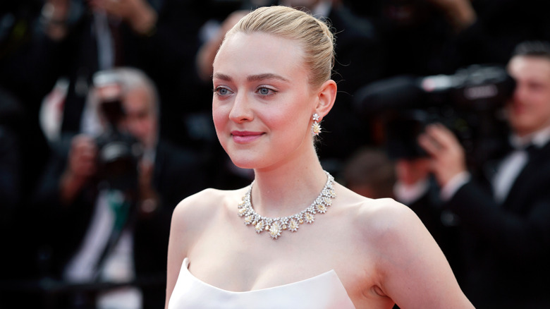 Dakota Fanning posing at Cannes