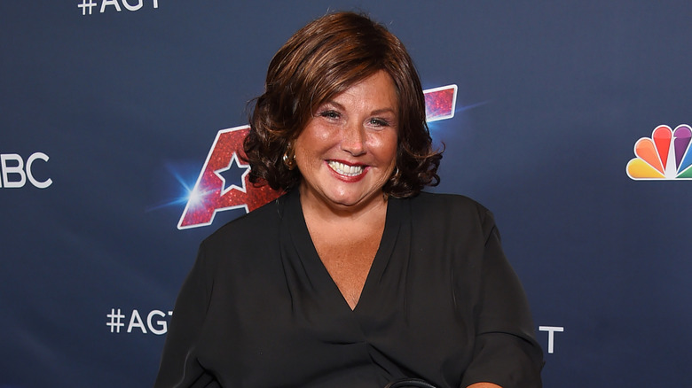 Abby Lee Miller smiling on the red carpet