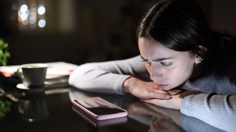 woman upset by social media