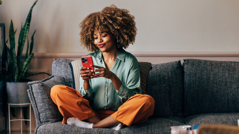 Smiling at phone