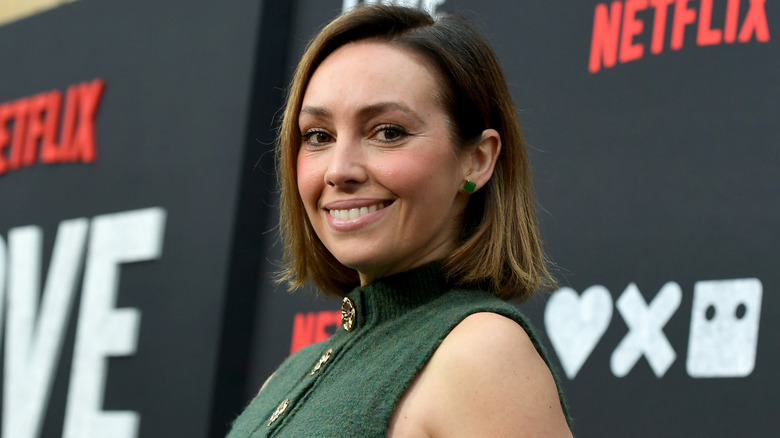 Emily O'Brien smiles on the red carpet in 2025