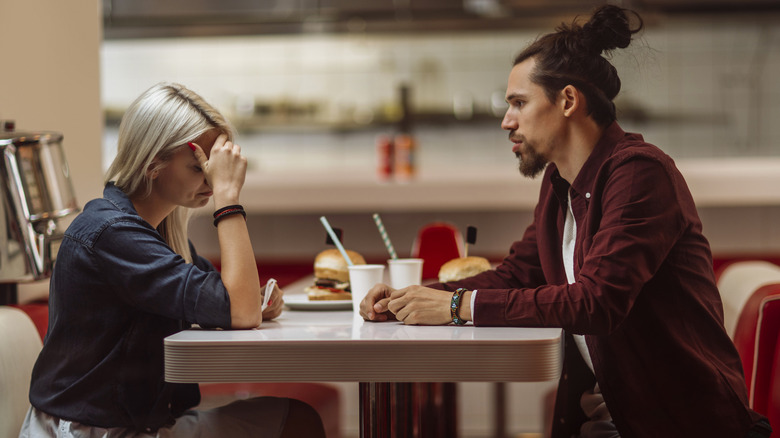 couple breaking up at diner
