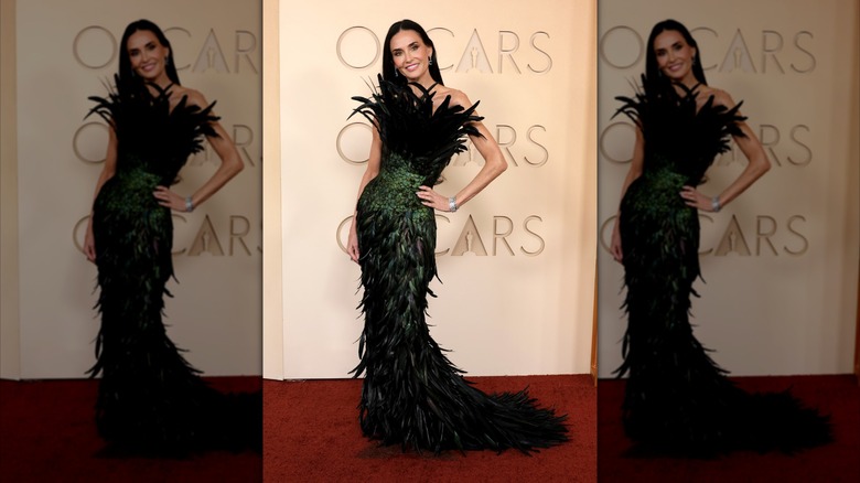 Demi Moore on the red carpet in a sculptural feather gown