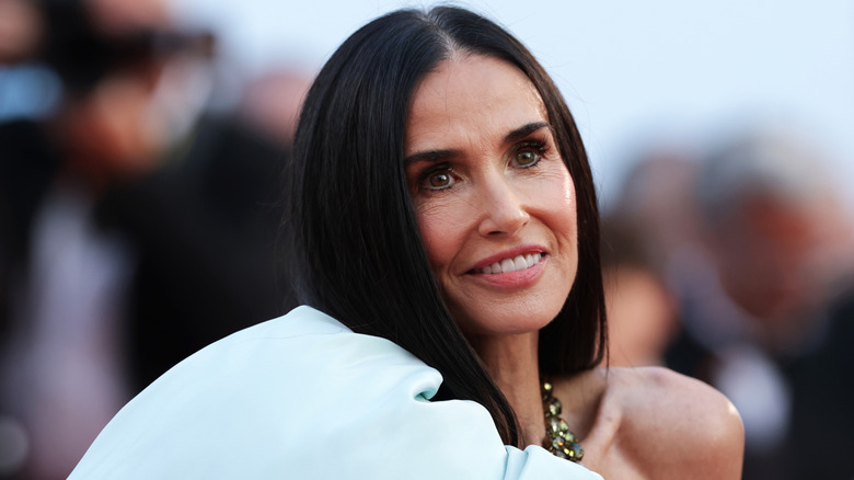 Demi Moore smiles on the red carpet in 2026