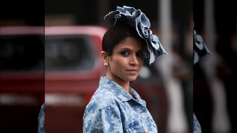 A woman wearing a denim headpiece 