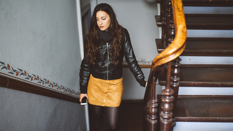 woman wearing skirt and tights