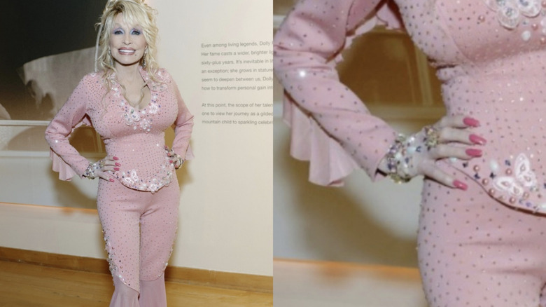 Dolly Parton in a pink outfit with pink nails at an event