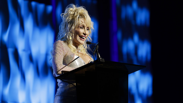 Dolly Parton wears wig and rhinestones