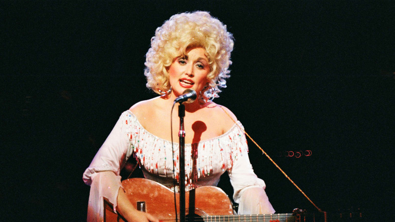 Dolly Parton performing on stage at The Dominion Theatre in 1983