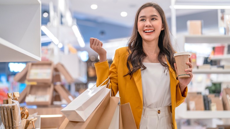 Woman holding bags and shopping