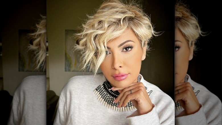 short cut with curly hair over eye