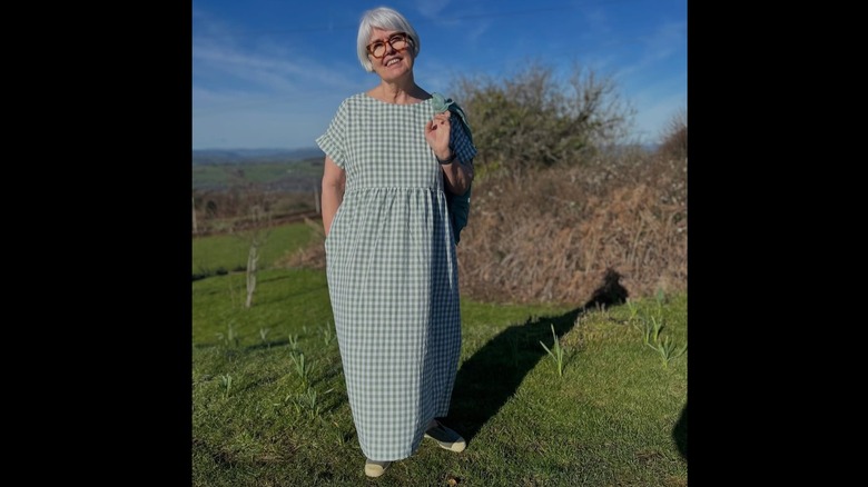 Penelope Menato wearing green and white plaid dress