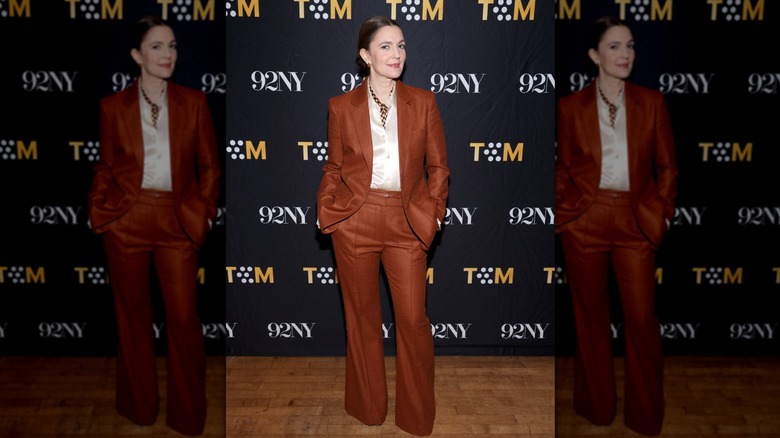 Drew Barrymore wearing a burnt orange suit