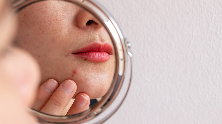 Woman looking in the mirror