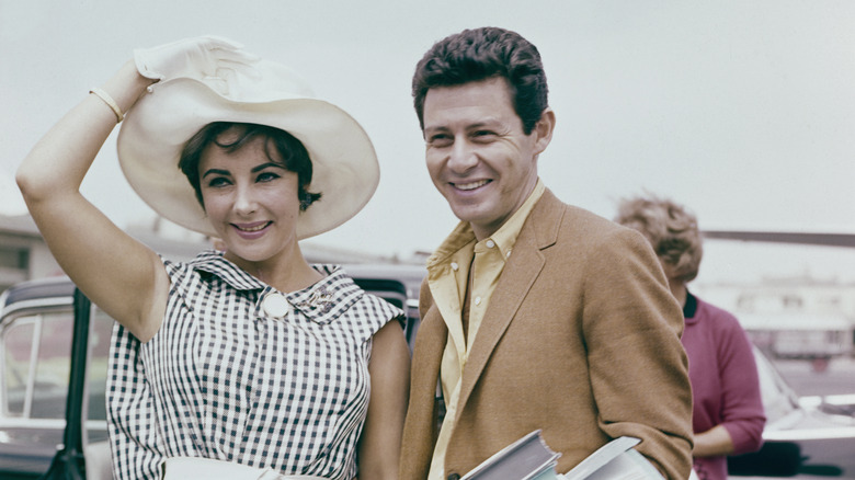 Elizabeth Taylor and Eddie Fisher smiling
