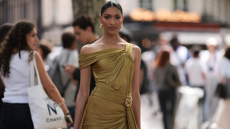 Woman in gold draped dress