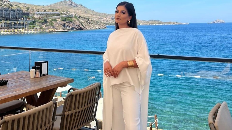 Woman in white draped top