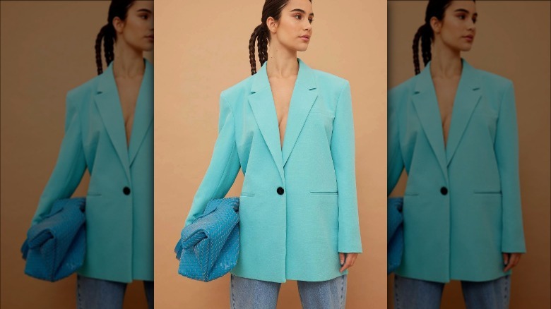 product photo of model with NA-KD blue bag