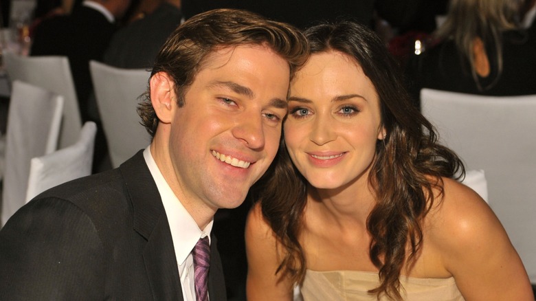 John Krasinski and Emily Blunt sitting at a table together in 2009