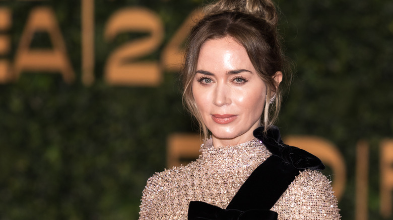 Emily Blunt wearing a brunette updo at a red carpet event