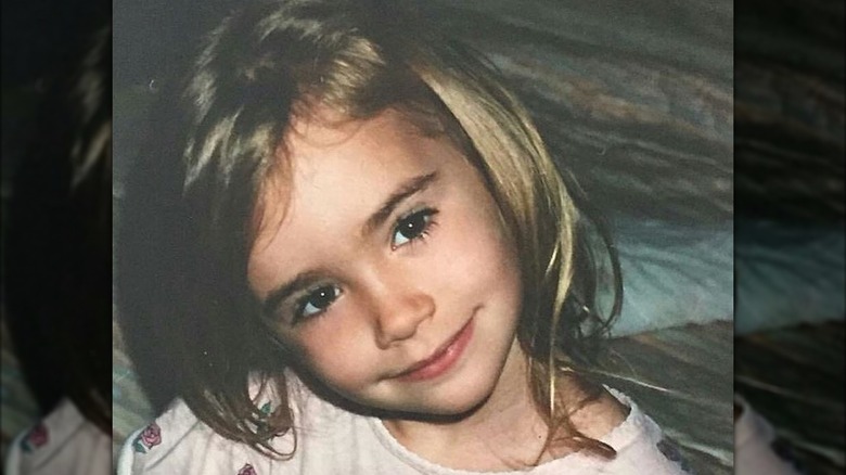 Young Lily Collins posing