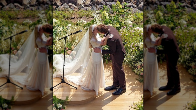 Emma Roberts and Cody John kissing at their wedding