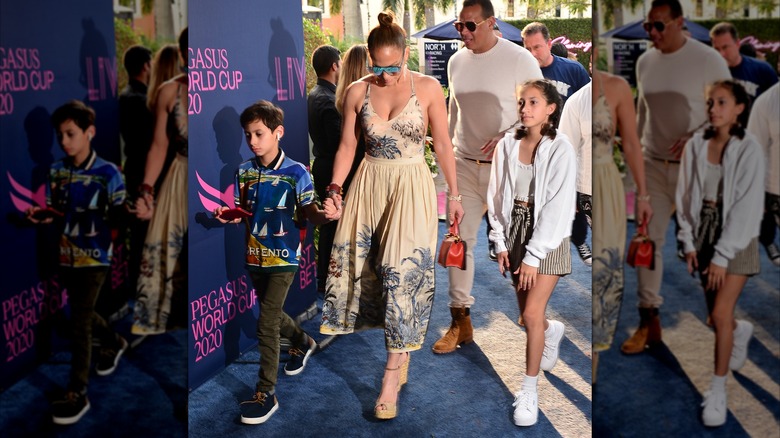 Emma Muniz on the red carpet with their mom and brother