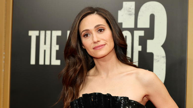 Emmy Rossum smiles on the red carpet in 2026
