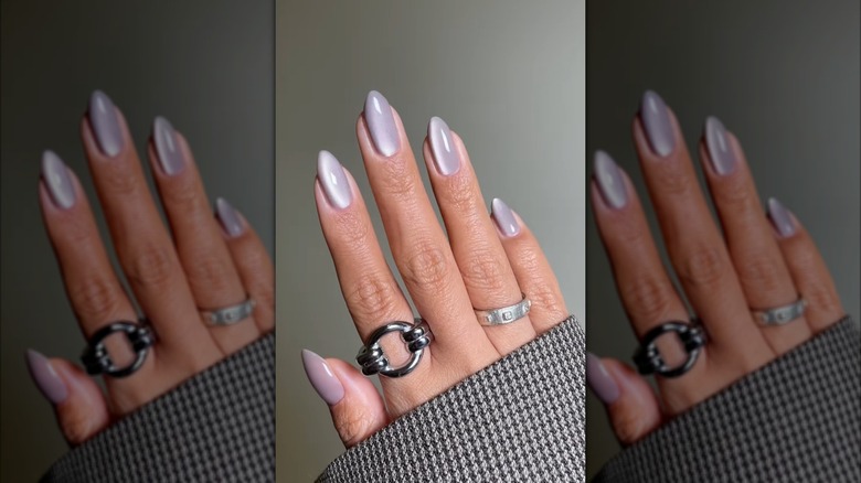 A hand with silvery velvet nails