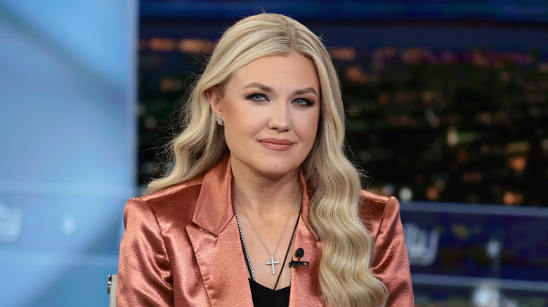 Erika Kirk in a copper blazer at an event