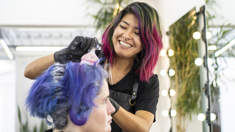 Hairdresser doing someone's hair