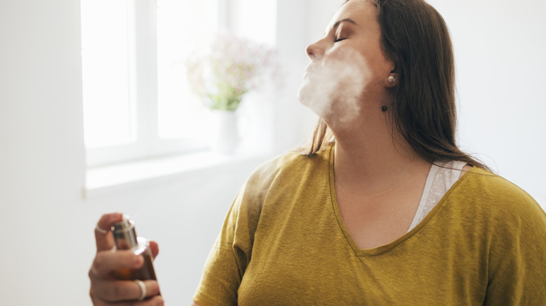 woman using setting spray