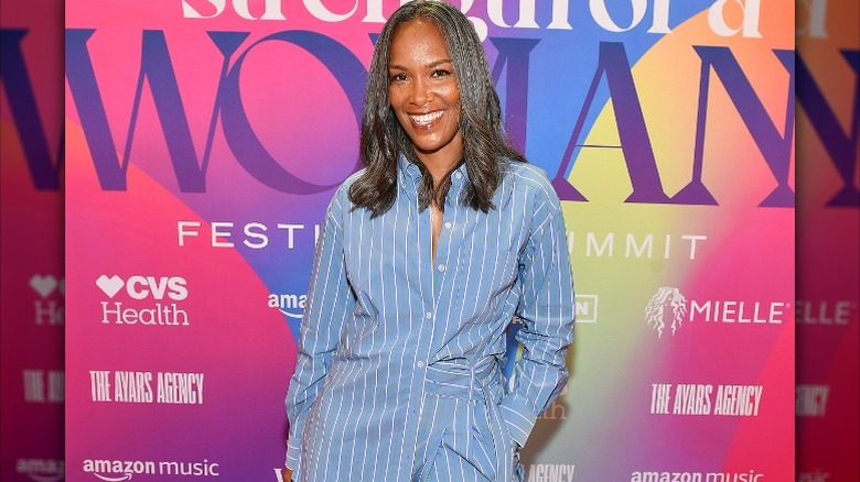 Mara Brock Ackil in a blue pinstripe suit