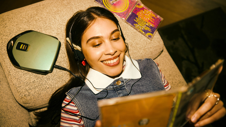 Woman listening to music on a CD player