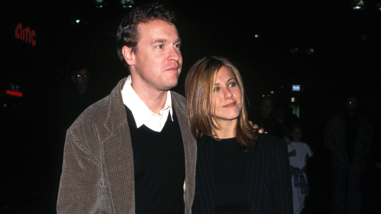 Jennifer Aniston and Tate Donovan attending the premiere of "Fools Rush In" in Los Angeles 1997