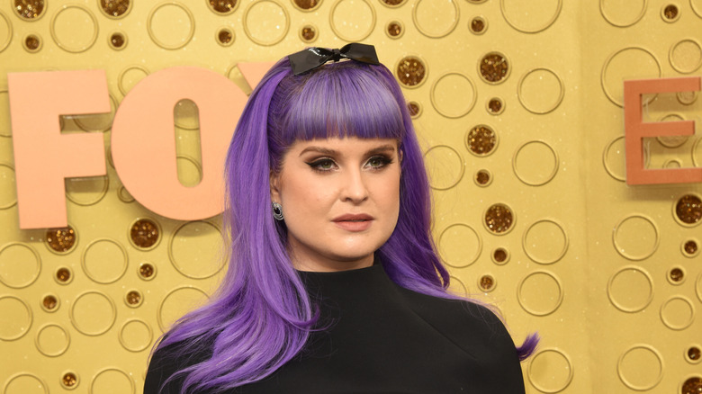 Kelly Osbourne posing