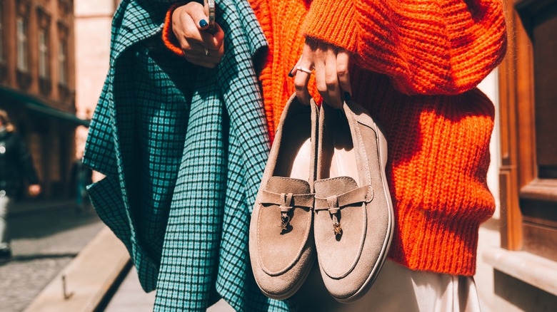 Holding loafers
