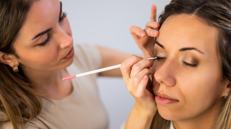 A close up of a mature woman's eyes with light eyeliner