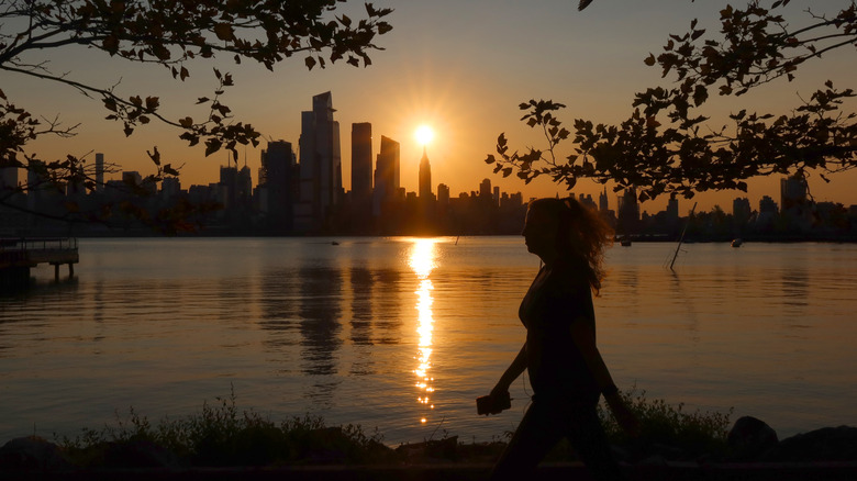 woman walking at sunrise