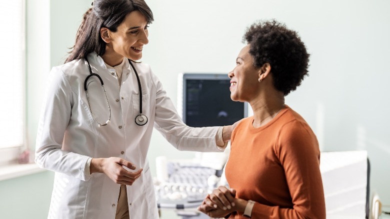 Woman talking with doctor