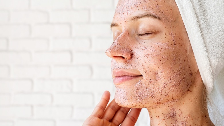 Woman uses coffee face scrub